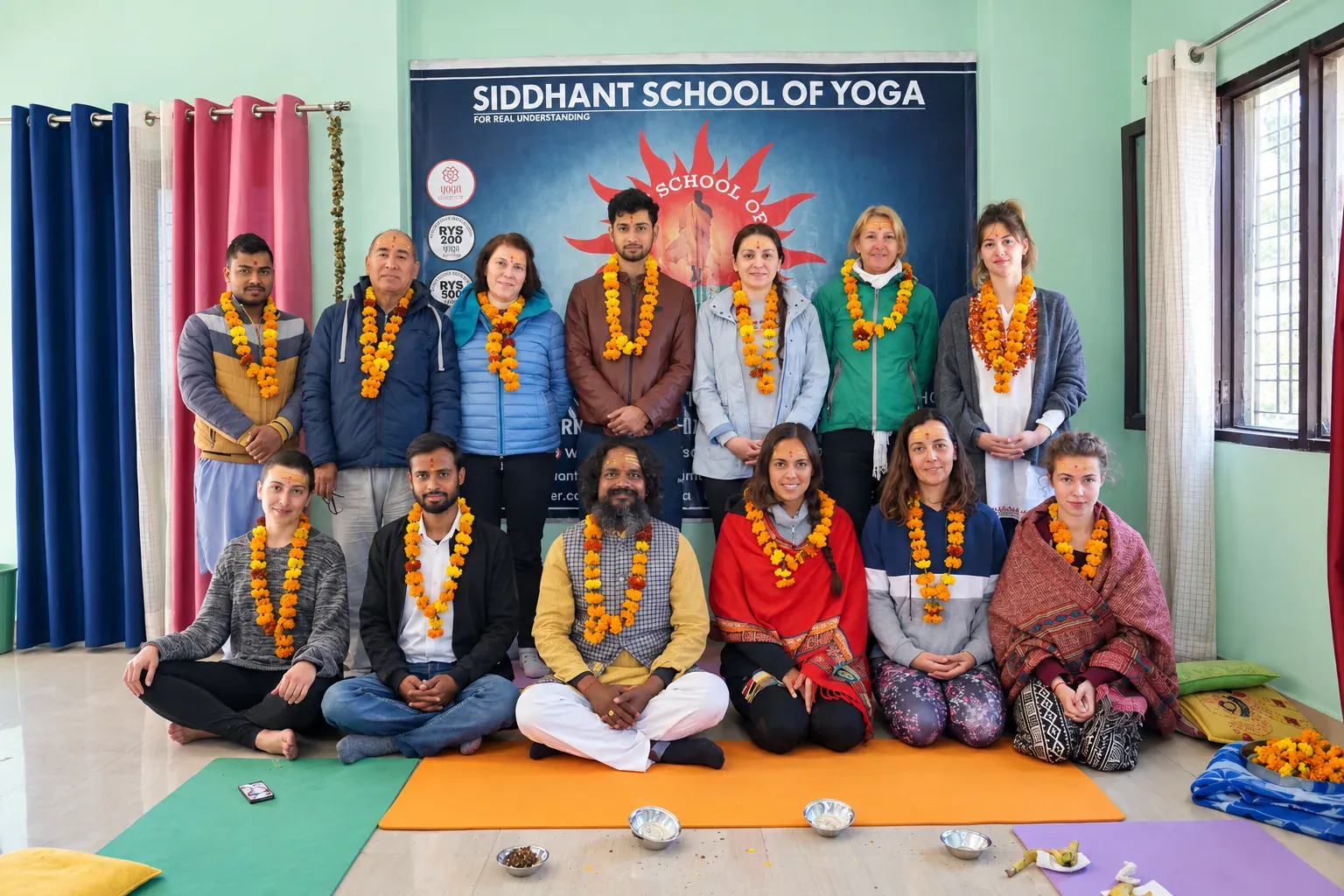 Graduating batch of Yoga Alliance certified 200-hour and 500-hour yoga teacher training students in Rishikesh