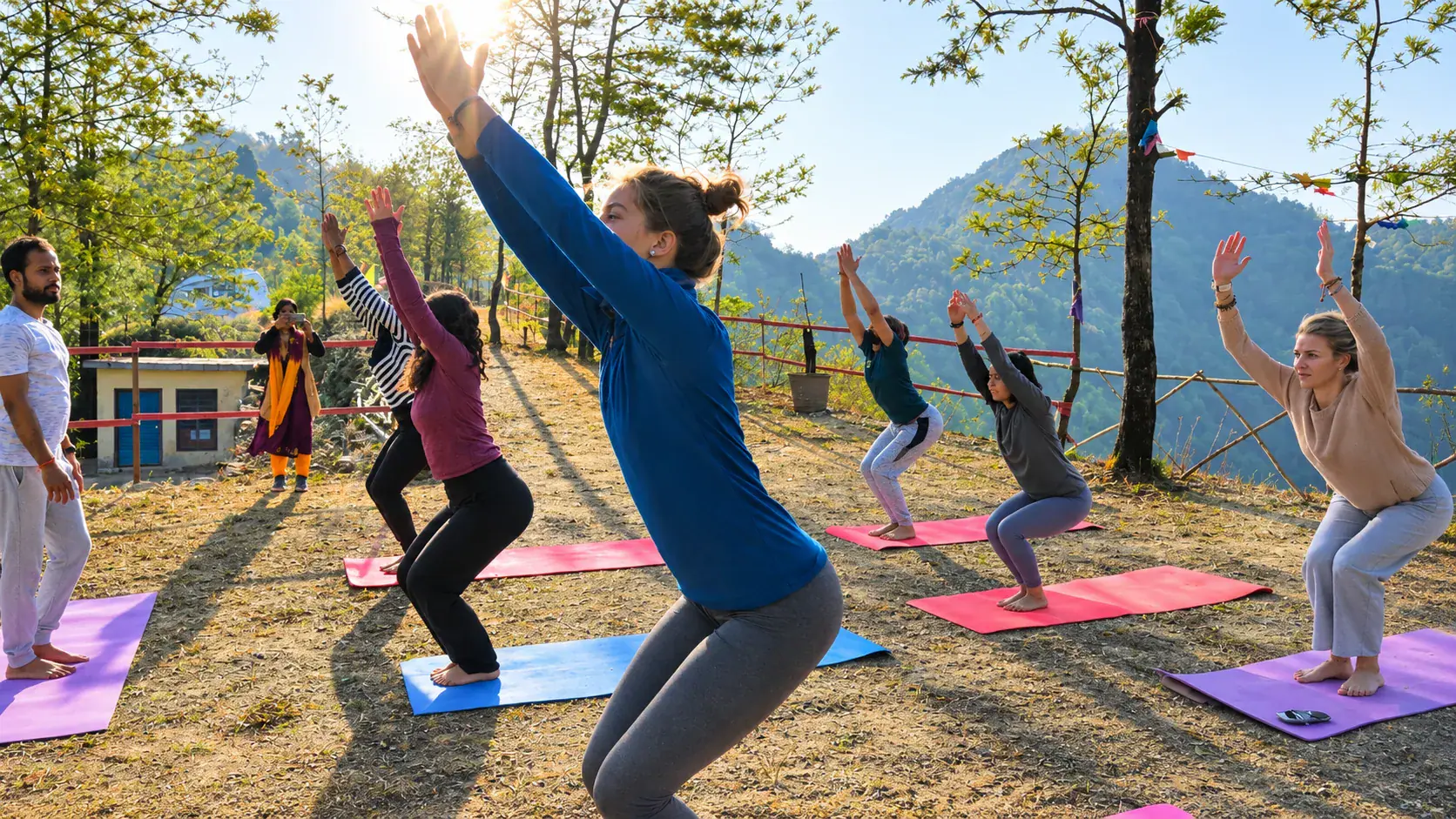 Yoga teacher training students practicing together in the Himalayan mountains near Rishikesh