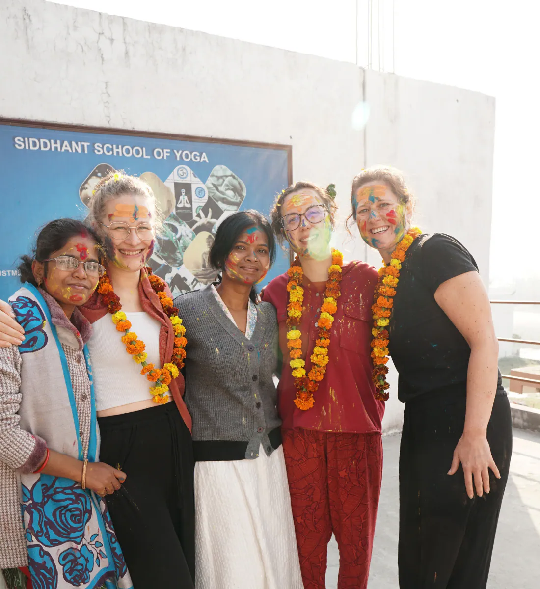Group of international yoga students celebrating Holi at Siddhant School of Yoga