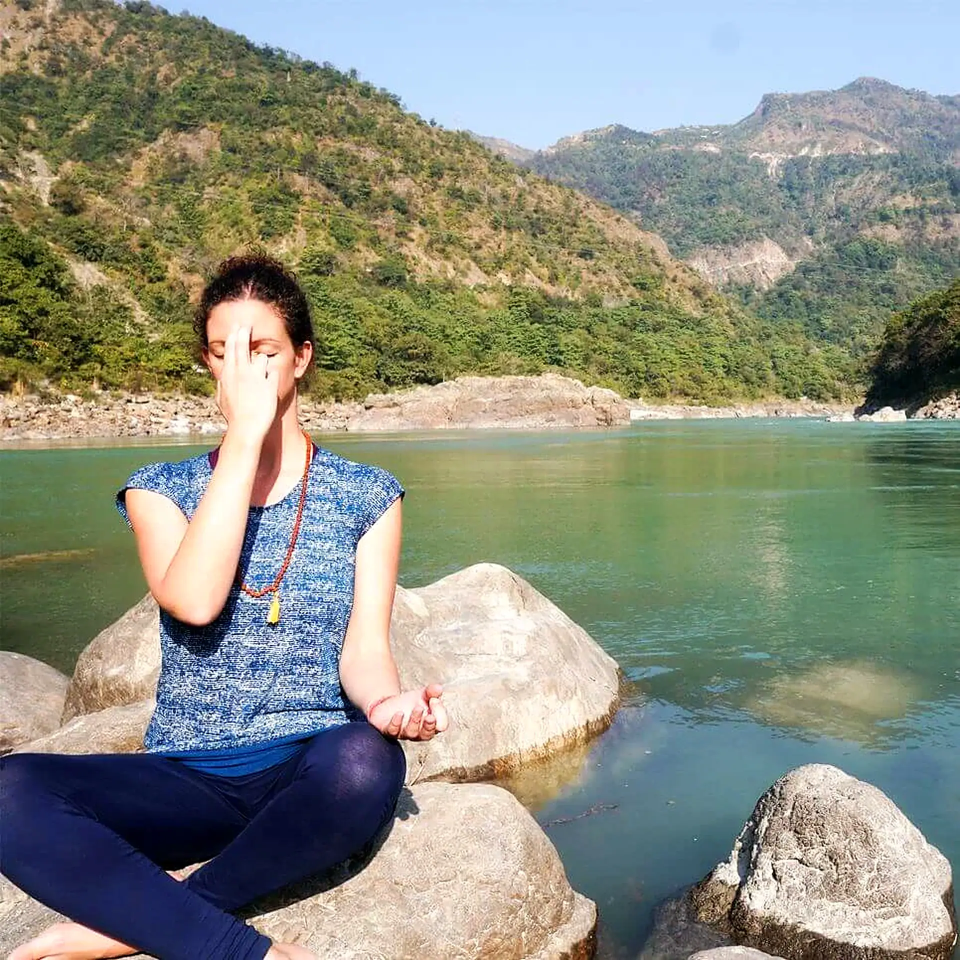 Pranayama practice by the Ganga river