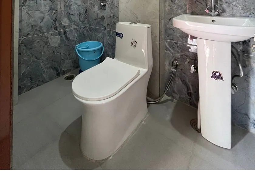 Attached bathroom with hot water at Siddhant School of Yoga