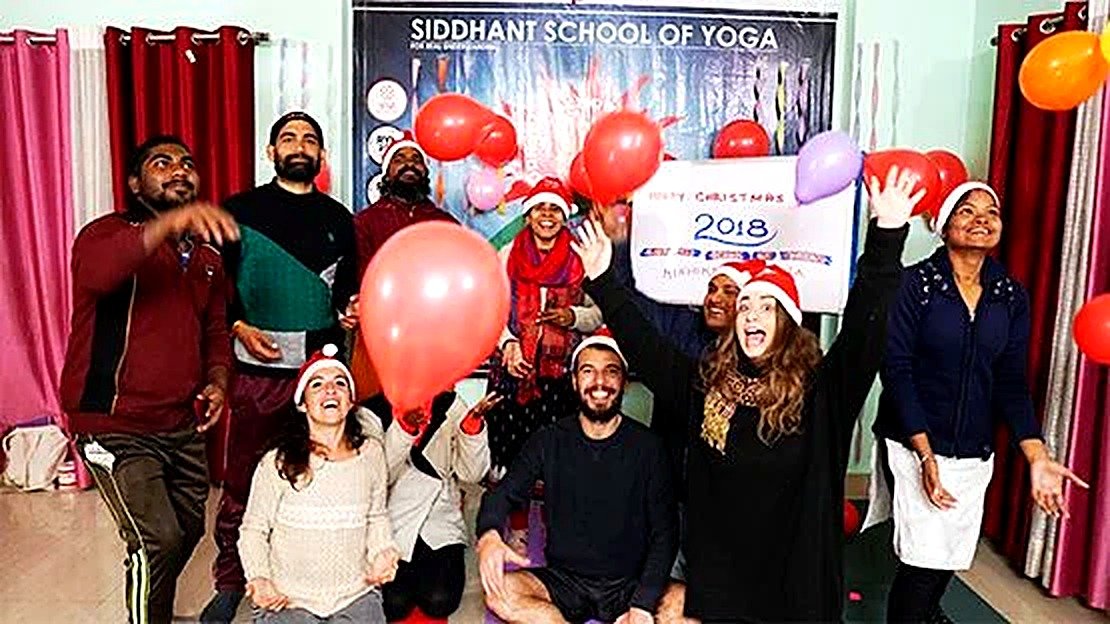 International students celebrating Christmas together at Siddhant School of Yoga
