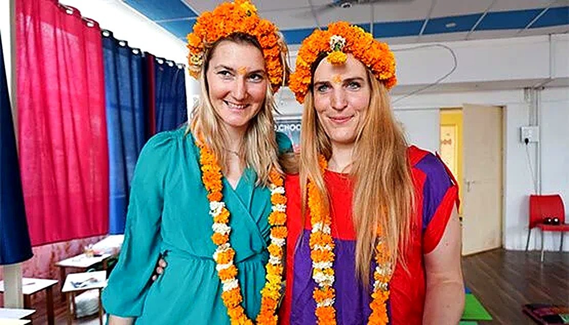 Teaching practicum graduates with flower garlands at Siddhant School of Yoga