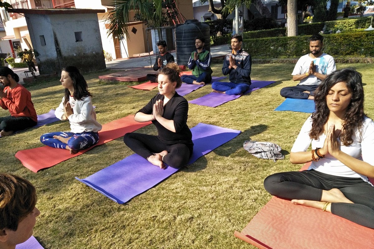 A small group of yoga teacher training students in Rishikesh