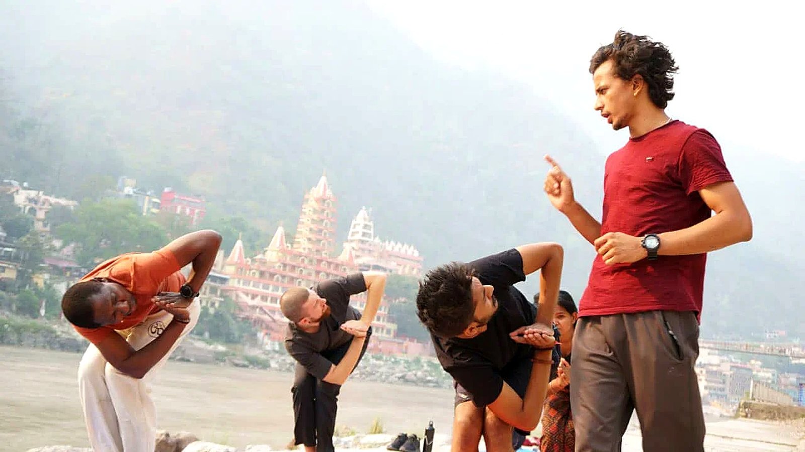 Yoga instructor demonstrating and guiding a class