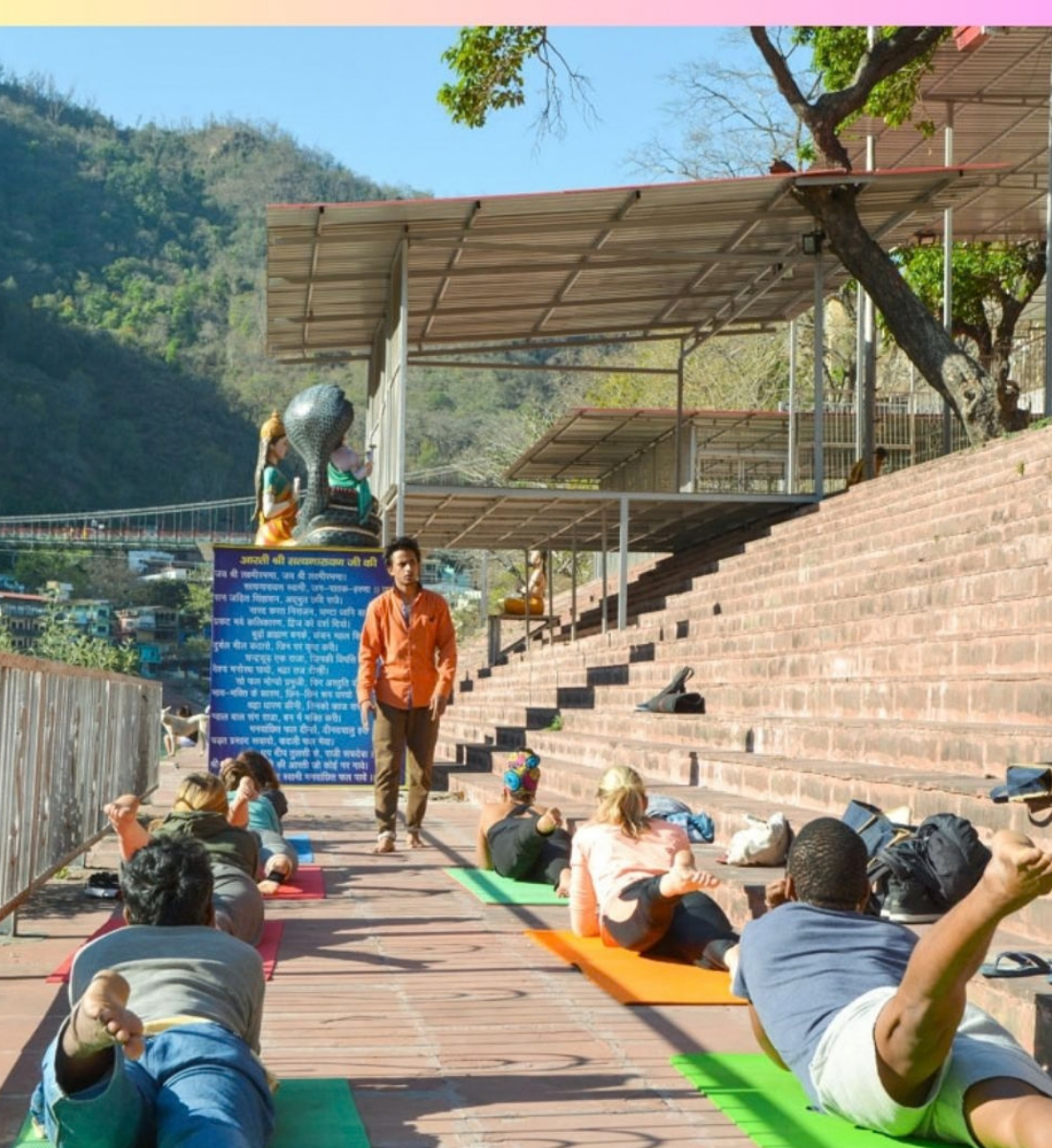Outdoor yoga class on the Ganga ghat near the Kundalini Yoga TTC ashram in Rishikesh