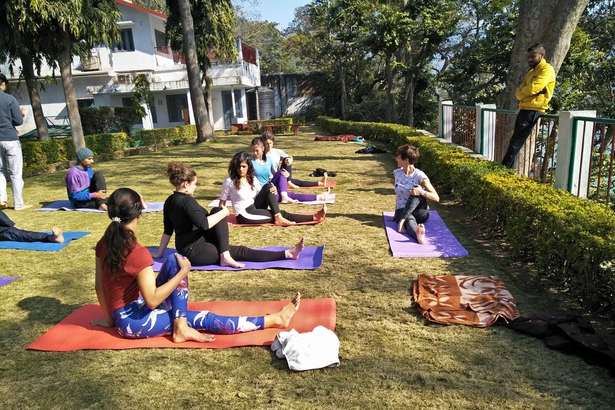 Students following a peer-led class in the garden
