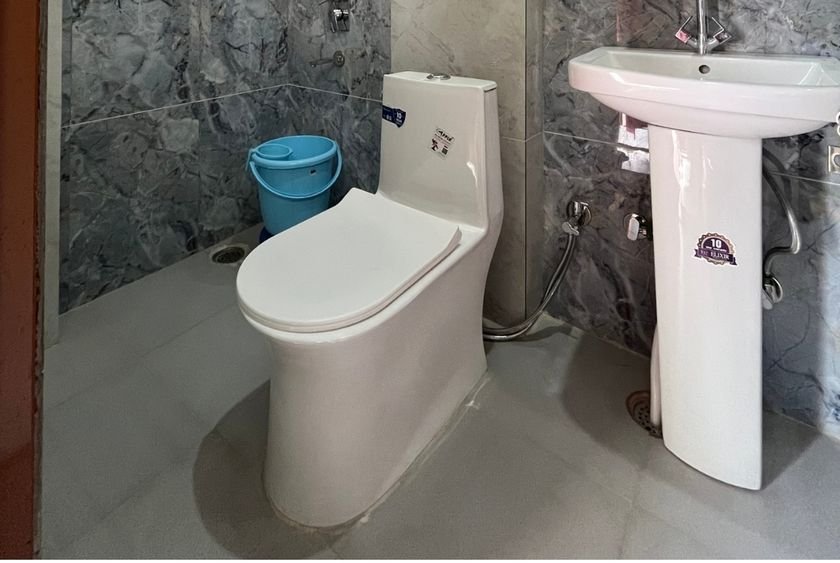 Attached bathroom with hot water at Siddhant School of Yoga